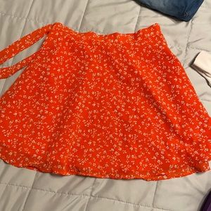 wrap around red flower skirt. ties on the side.